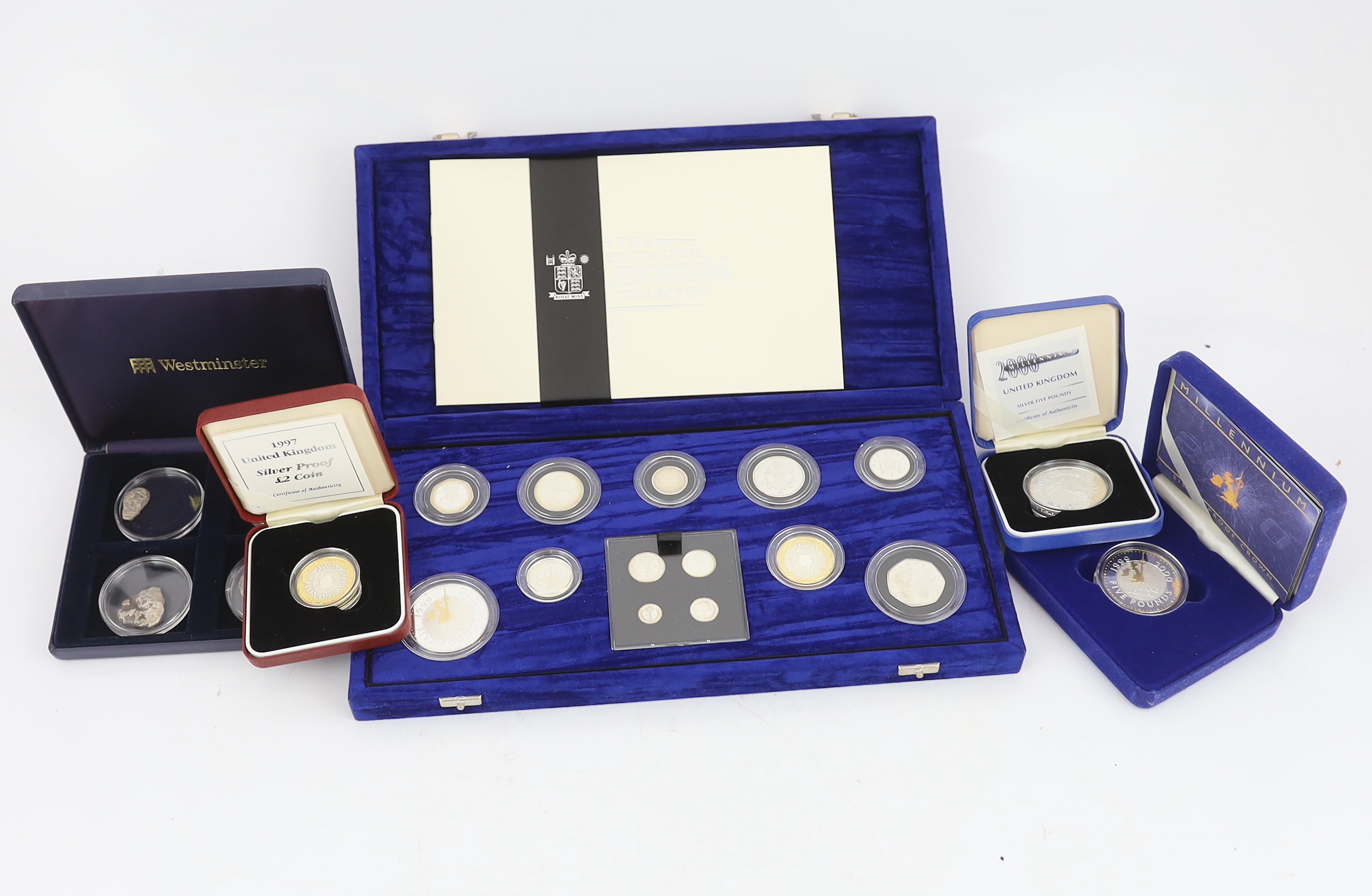 QEII Royal Mint proof coins – the United Kingdom millennium silver collection five pence to five pounds with Maundy 1p to 4p , two millennium silver proof crowns and a 1997 silver proof two pound coin, together with West